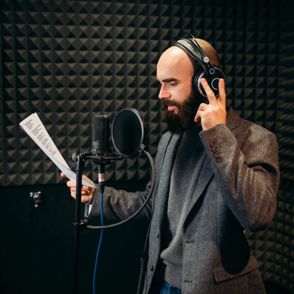 male-singer-songs-in-audio-recording-studio.jpg